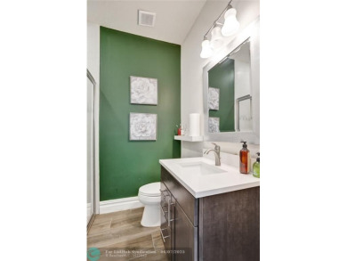 Check out this lovely, five-bedroom, three-bathroom home. This on Woodmont Country Club in Florida - for sale on GolfHomes.com, golf home, golf lot
