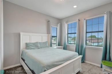 Check out this lovely, five-bedroom, three-bathroom home. This on Woodmont Country Club in Florida - for sale on GolfHomes.com, golf home, golf lot