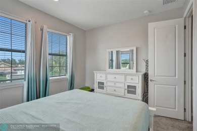 Check out this lovely, five-bedroom, three-bathroom home. This on Woodmont Country Club in Florida - for sale on GolfHomes.com, golf home, golf lot