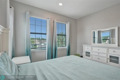 Check out this lovely, five-bedroom, three-bathroom home. This on Woodmont Country Club in Florida - for sale on GolfHomes.com, golf home, golf lot