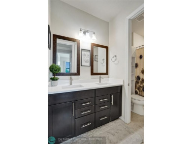 Check out this lovely, five-bedroom, three-bathroom home. This on Woodmont Country Club in Florida - for sale on GolfHomes.com, golf home, golf lot
