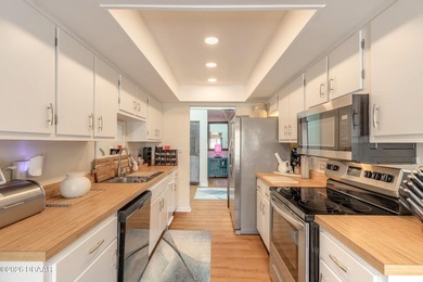 Located in the highly sought-after Sugar Mill Country Club on Sugar Mill Country Club in Florida - for sale on GolfHomes.com, golf home, golf lot