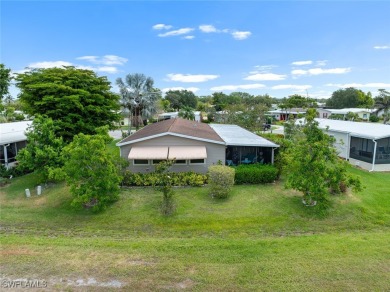 Enjoy living the Naples lifestyle in this light and bright well on Riviera Golf Club in Florida - for sale on GolfHomes.com, golf home, golf lot
