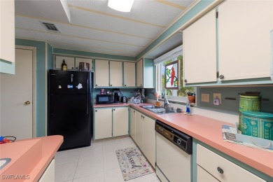 Enjoy living the Naples lifestyle in this light and bright well on Riviera Golf Club in Florida - for sale on GolfHomes.com, golf home, golf lot