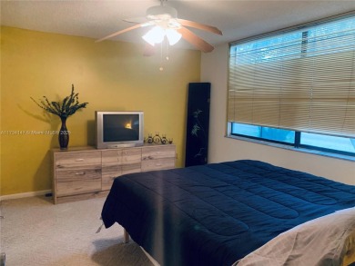 Charming and roomy 2 bedroom 2 bath condo with enclosed porch on Oriole Golf and Tennis Club in Florida - for sale on GolfHomes.com, golf home, golf lot