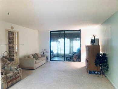 Charming and roomy 2 bedroom 2 bath condo with enclosed porch on Oriole Golf and Tennis Club in Florida - for sale on GolfHomes.com, golf home, golf lot