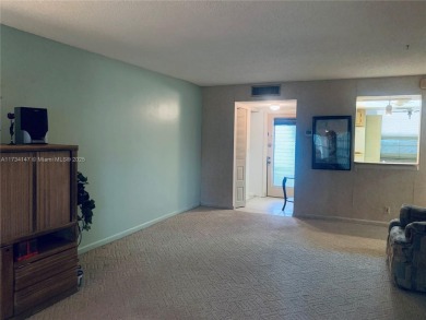 Charming and roomy 2 bedroom 2 bath condo with enclosed porch on Oriole Golf and Tennis Club in Florida - for sale on GolfHomes.com, golf home, golf lot
