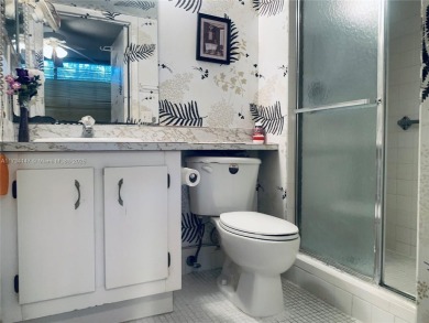 Charming and roomy 2 bedroom 2 bath condo with enclosed porch on Oriole Golf and Tennis Club in Florida - for sale on GolfHomes.com, golf home, golf lot