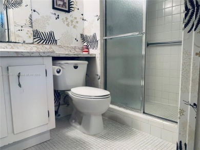 Charming and roomy 2 bedroom 2 bath condo with enclosed porch on Oriole Golf and Tennis Club in Florida - for sale on GolfHomes.com, golf home, golf lot