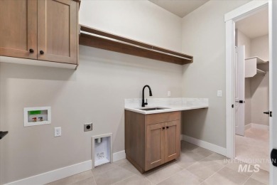 This beautifully designed modern farmhouse backs up to the golf on Falcon Crest Golf Club in Idaho - for sale on GolfHomes.com, golf home, golf lot