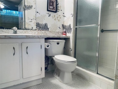 Charming and roomy 2 bedroom 2 bath condo with enclosed porch on Oriole Golf and Tennis Club in Florida - for sale on GolfHomes.com, golf home, golf lot