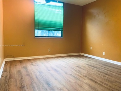 Charming and roomy 2 bedroom 2 bath condo with enclosed porch on Oriole Golf and Tennis Club in Florida - for sale on GolfHomes.com, golf home, golf lot
