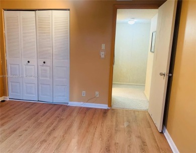 Charming and roomy 2 bedroom 2 bath condo with enclosed porch on Oriole Golf and Tennis Club in Florida - for sale on GolfHomes.com, golf home, golf lot
