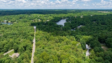 Imagine building your getaway in a quiet, wooded setting just on Lake Tansi Village Country Club in Tennessee - for sale on GolfHomes.com, golf home, golf lot