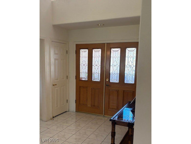 From the front courtyd entry to the views accessible from inside on Highland Falls Golf Club in Nevada - for sale on GolfHomes.com, golf home, golf lot