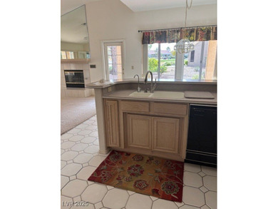 From the front courtyd entry to the views accessible from inside on Highland Falls Golf Club in Nevada - for sale on GolfHomes.com, golf home, golf lot