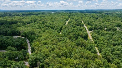 Imagine building your getaway in a quiet, wooded setting just on Lake Tansi Village Country Club in Tennessee - for sale on GolfHomes.com, golf home, golf lot