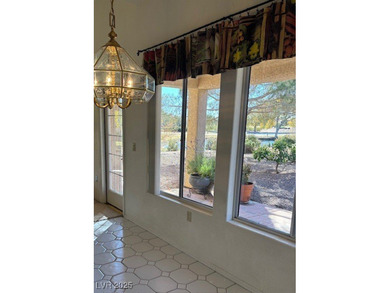From the front courtyd entry to the views accessible from inside on Highland Falls Golf Club in Nevada - for sale on GolfHomes.com, golf home, golf lot