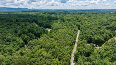 Imagine building your getaway in a quiet, wooded setting just on Lake Tansi Village Country Club in Tennessee - for sale on GolfHomes.com, golf home, golf lot