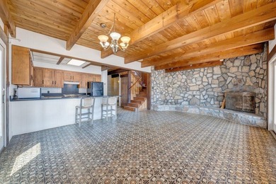 Million-dollar lake and mountain views define this on Waters Edge Country Club in Virginia - for sale on GolfHomes.com, golf home, golf lot