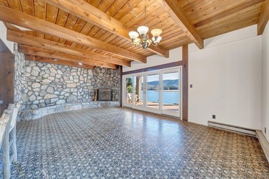 Million-dollar lake and mountain views define this on Waters Edge Country Club in Virginia - for sale on GolfHomes.com, golf home, golf lot