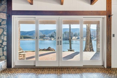 Million-dollar lake and mountain views define this on Waters Edge Country Club in Virginia - for sale on GolfHomes.com, golf home, golf lot