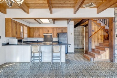 Million-dollar lake and mountain views define this on Waters Edge Country Club in Virginia - for sale on GolfHomes.com, golf home, golf lot