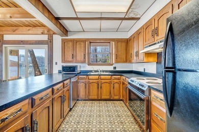 Million-dollar lake and mountain views define this on Waters Edge Country Club in Virginia - for sale on GolfHomes.com, golf home, golf lot