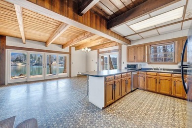 Million-dollar lake and mountain views define this on Waters Edge Country Club in Virginia - for sale on GolfHomes.com, golf home, golf lot