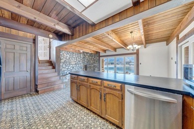 Million-dollar lake and mountain views define this on Waters Edge Country Club in Virginia - for sale on GolfHomes.com, golf home, golf lot