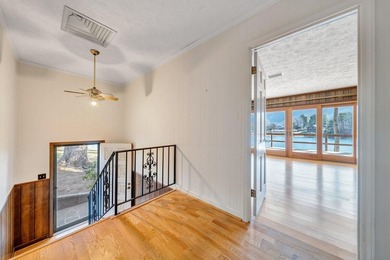 Million-dollar lake and mountain views define this on Waters Edge Country Club in Virginia - for sale on GolfHomes.com, golf home, golf lot