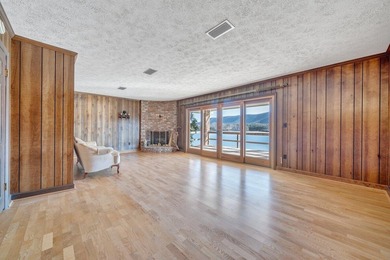 Million-dollar lake and mountain views define this on Waters Edge Country Club in Virginia - for sale on GolfHomes.com, golf home, golf lot