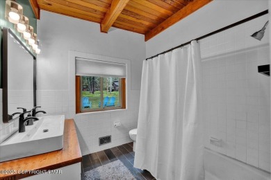 Step into this 3-bedroom, 2-bath Lake Harmony home showcasing on Split Rock Resort and Country Club in Pennsylvania - for sale on GolfHomes.com, golf home, golf lot