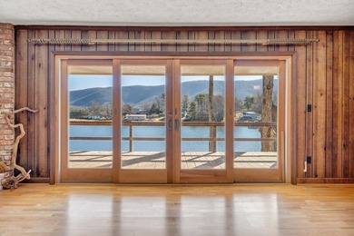 Million-dollar lake and mountain views define this on Waters Edge Country Club in Virginia - for sale on GolfHomes.com, golf home, golf lot