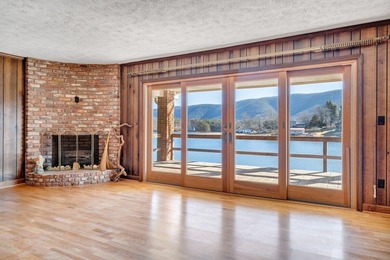 Million-dollar lake and mountain views define this on Waters Edge Country Club in Virginia - for sale on GolfHomes.com, golf home, golf lot