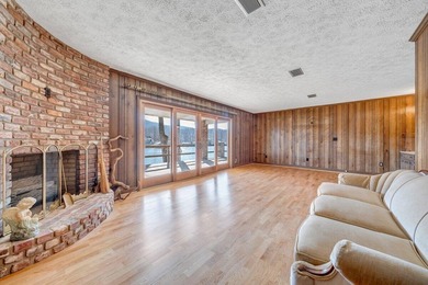 Million-dollar lake and mountain views define this on Waters Edge Country Club in Virginia - for sale on GolfHomes.com, golf home, golf lot