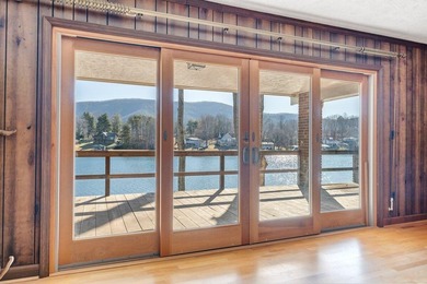 Million-dollar lake and mountain views define this on Waters Edge Country Club in Virginia - for sale on GolfHomes.com, golf home, golf lot
