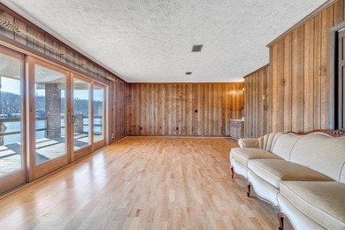 Million-dollar lake and mountain views define this on Waters Edge Country Club in Virginia - for sale on GolfHomes.com, golf home, golf lot