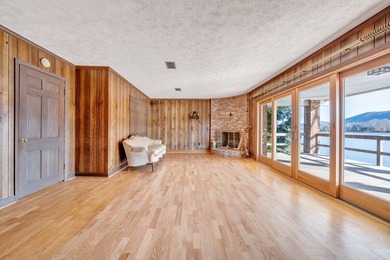 Million-dollar lake and mountain views define this on Waters Edge Country Club in Virginia - for sale on GolfHomes.com, golf home, golf lot