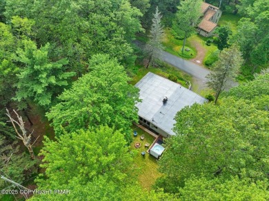 Step into this 3-bedroom, 2-bath Lake Harmony home showcasing on Split Rock Resort and Country Club in Pennsylvania - for sale on GolfHomes.com, golf home, golf lot