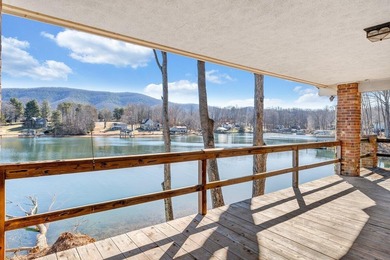 Million-dollar lake and mountain views define this on Waters Edge Country Club in Virginia - for sale on GolfHomes.com, golf home, golf lot