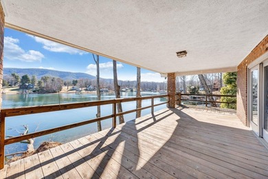 Million-dollar lake and mountain views define this on Waters Edge Country Club in Virginia - for sale on GolfHomes.com, golf home, golf lot