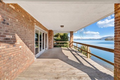 Million-dollar lake and mountain views define this on Waters Edge Country Club in Virginia - for sale on GolfHomes.com, golf home, golf lot