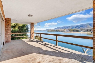 Million-dollar lake and mountain views define this on Waters Edge Country Club in Virginia - for sale on GolfHomes.com, golf home, golf lot