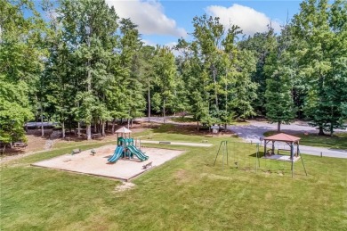 Nestled on a large, private, wooded lot in the serene Bent Tree on Bent Tree Golf Course in Georgia - for sale on GolfHomes.com, golf home, golf lot