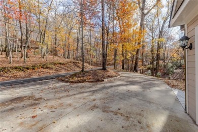 Nestled on a large, private, wooded lot in the serene Bent Tree on Bent Tree Golf Course in Georgia - for sale on GolfHomes.com, golf home, golf lot