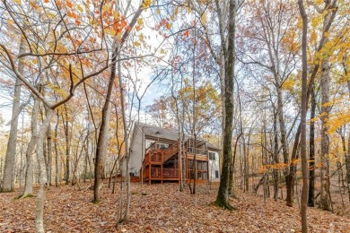 Nestled on a large, private, wooded lot in the serene Bent Tree on Bent Tree Golf Course in Georgia - for sale on GolfHomes.com, golf home, golf lot