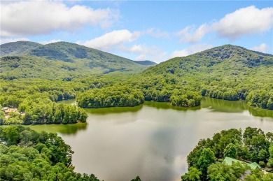 Nestled on a large, private, wooded lot in the serene Bent Tree on Bent Tree Golf Course in Georgia - for sale on GolfHomes.com, golf home, golf lot