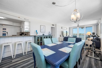 Stunning end unit offering water views galore!  This turnkey on Isla Del Sol Yacht and Country Club in Florida - for sale on GolfHomes.com, golf home, golf lot