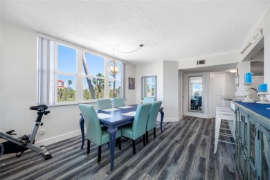 Stunning end unit offering water views galore!  This turnkey on Isla Del Sol Yacht and Country Club in Florida - for sale on GolfHomes.com, golf home, golf lot